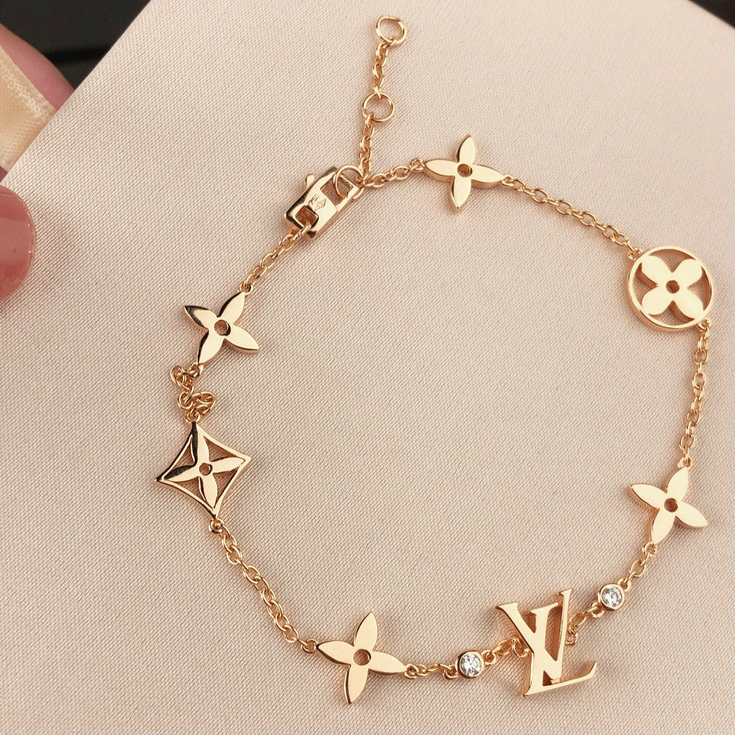 [エテルナジュエルズ]星と太陽の7モチーフ ゴールドブレスレット